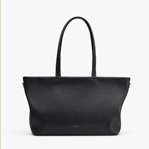 Cuyana Small Zipper Tote in Black Pebbled leather including crossbody strap.